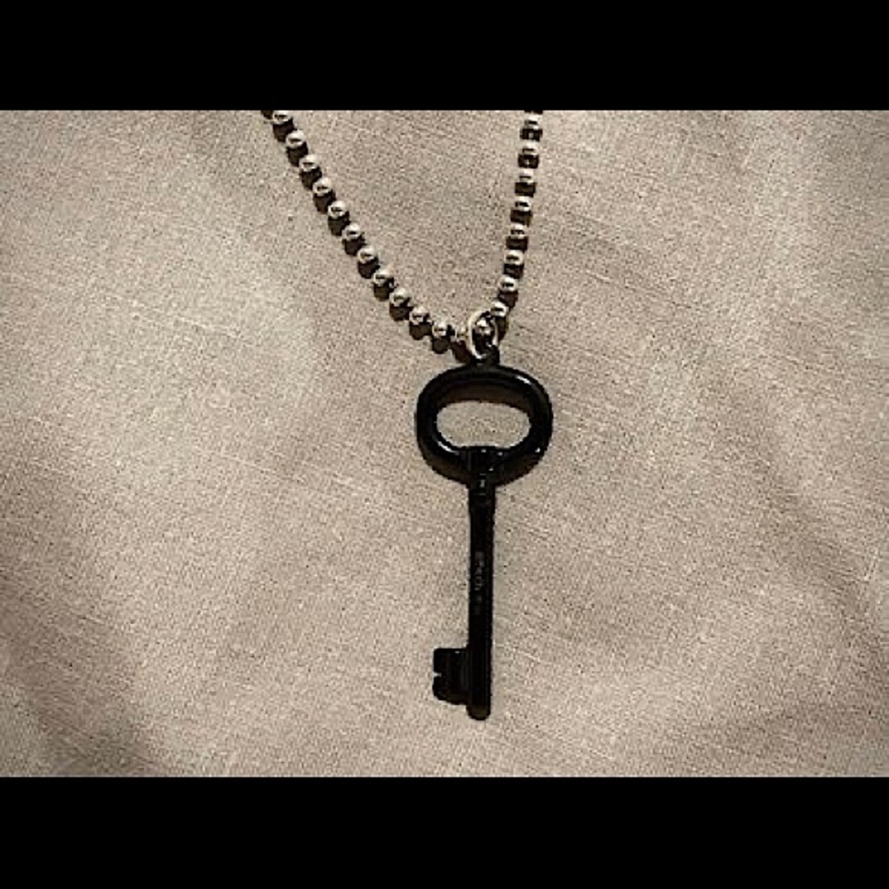 Tiffany & Co rare Titanium Key Pendant and 18” Sterling Silver Bead Necklace